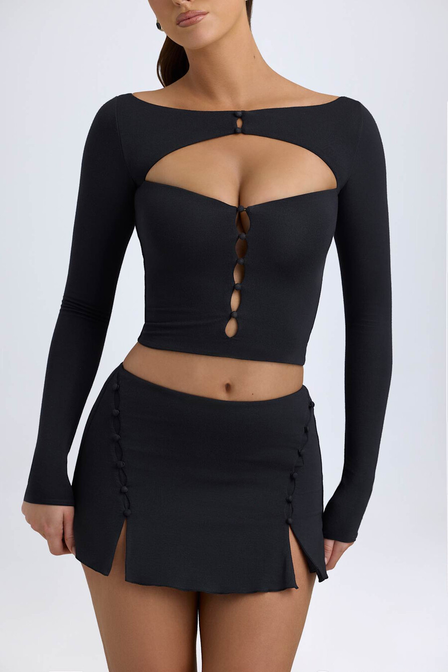 modal minirok met knoopdetails en lage taille in zwart