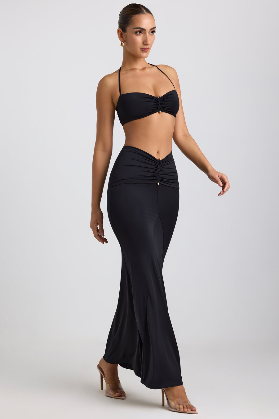 soepelvallende maxi-rok van jersey met metalen details in zwart.