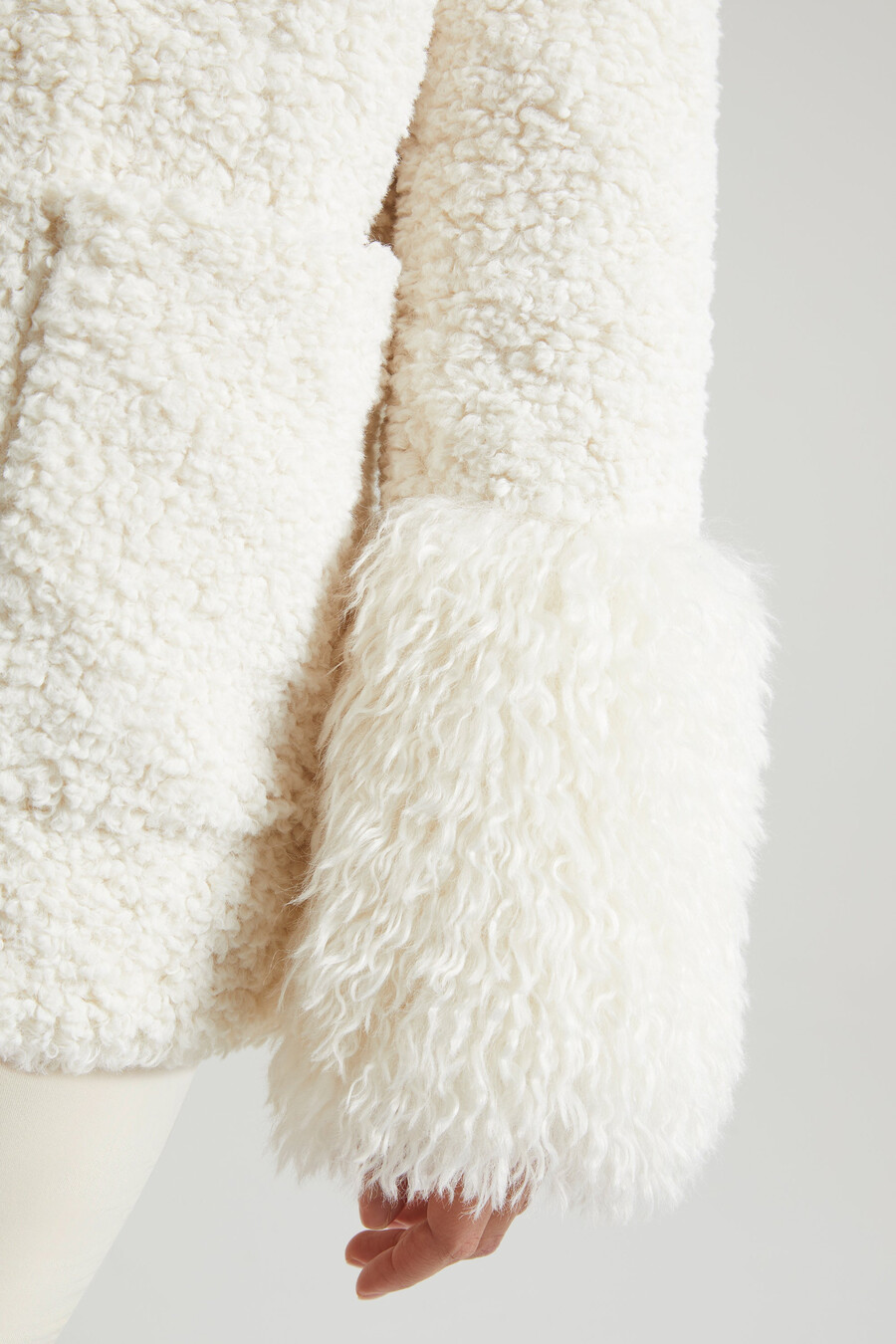crèmekleurige shearlingjas met grote voorzakken
