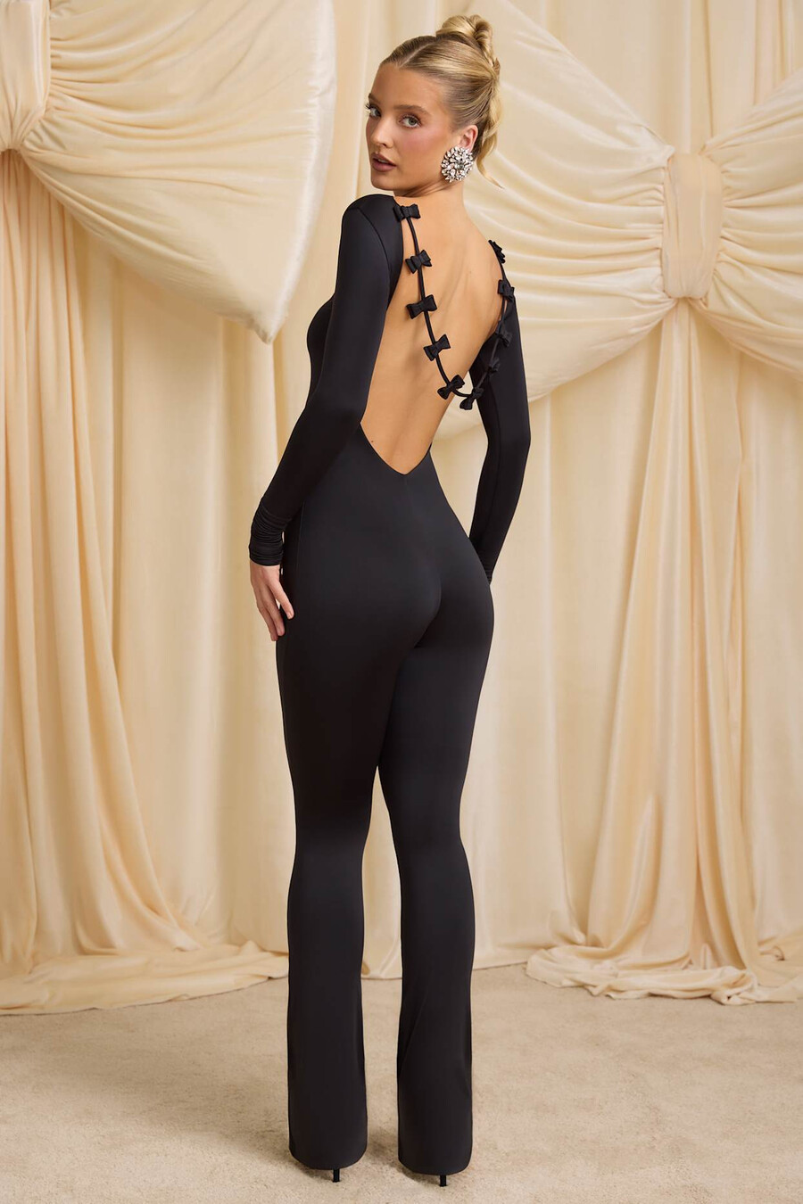 lange nauwsluitende jumpsuit van jersey met strikdetail in zwart