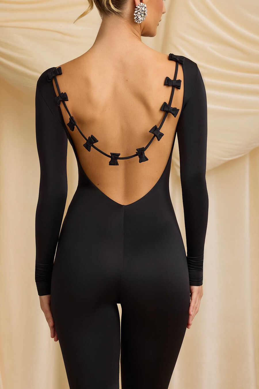 lange nauwsluitende jumpsuit van jersey met strikdetail in zwart