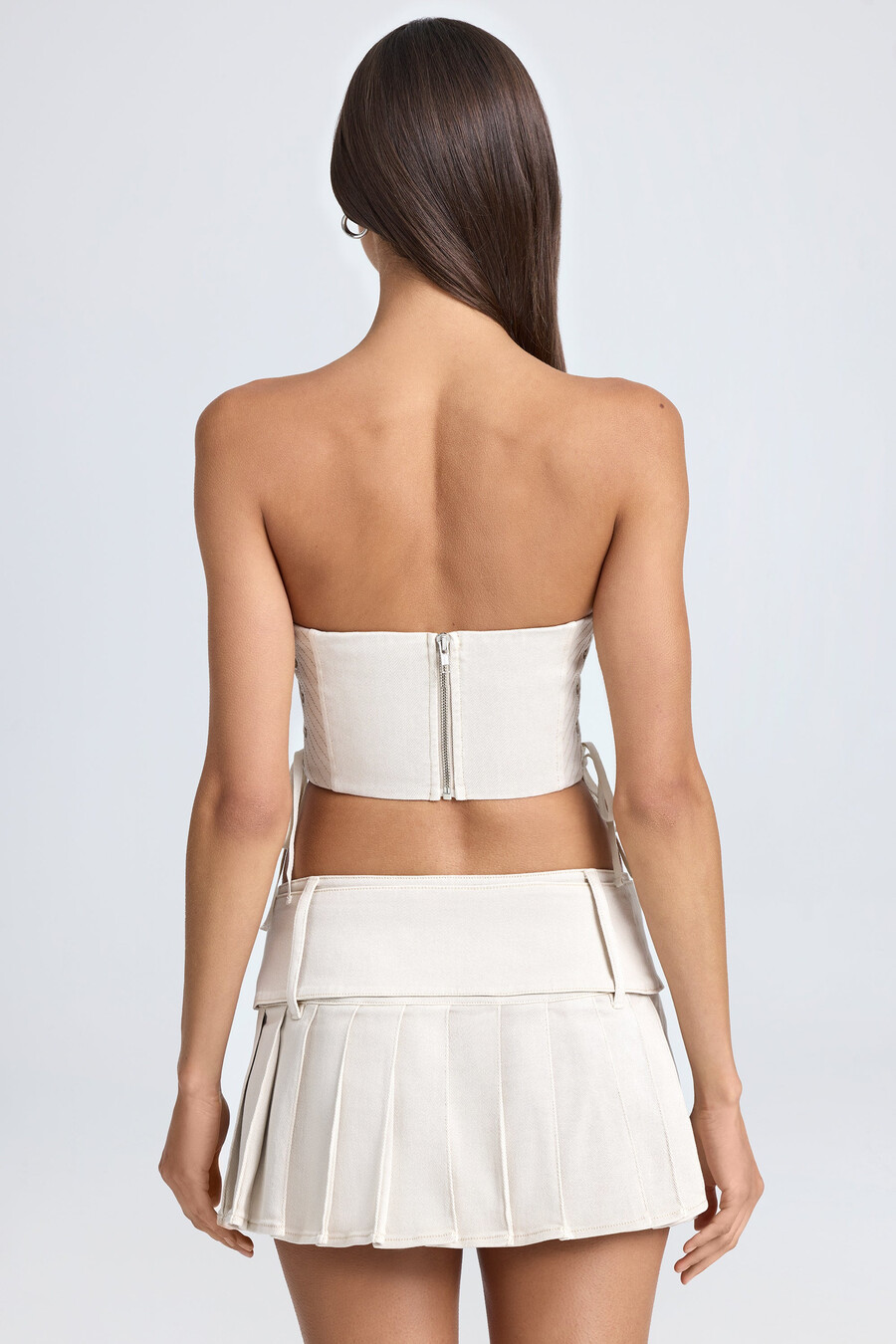 geplooide micro-minirok met ceintuur en lage taille in ecru