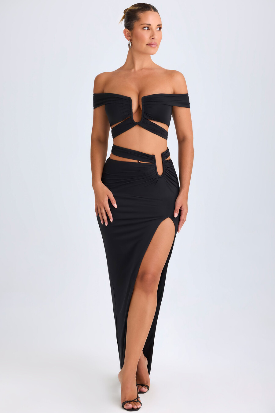 asymmetrische maxi-rok met uitsnijdingen in zwart