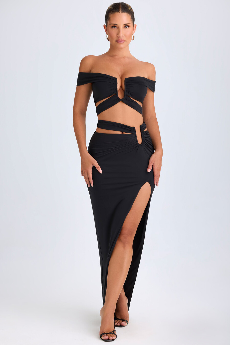 asymmetrische maxi-rok met uitsnijdingen in zwart