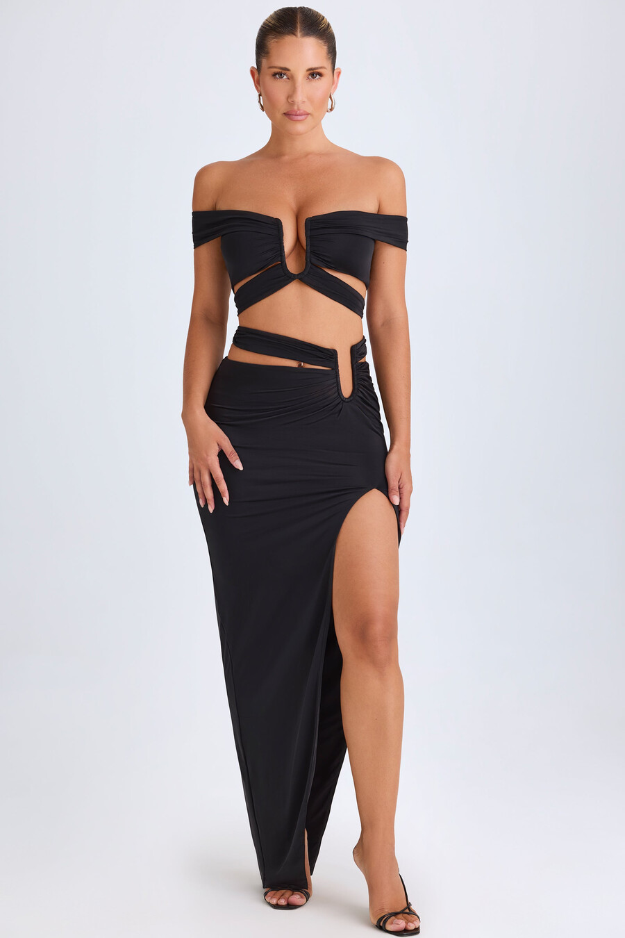 asymmetrische maxi-rok met uitsnijdingen in zwart